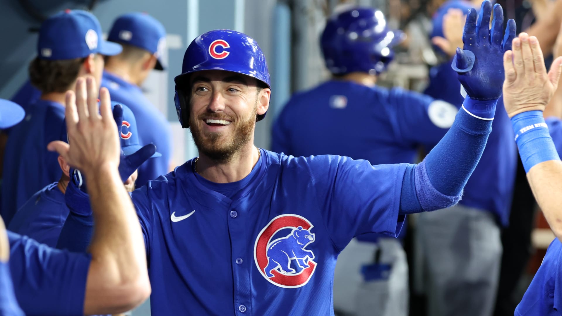 Chicago Cubs right fielder Cody Bellinger (24) is greeted in the dugout after hitting a 3-run home run during the fifth inning against the Los Angeles Dodgers at Dodger Stadium.