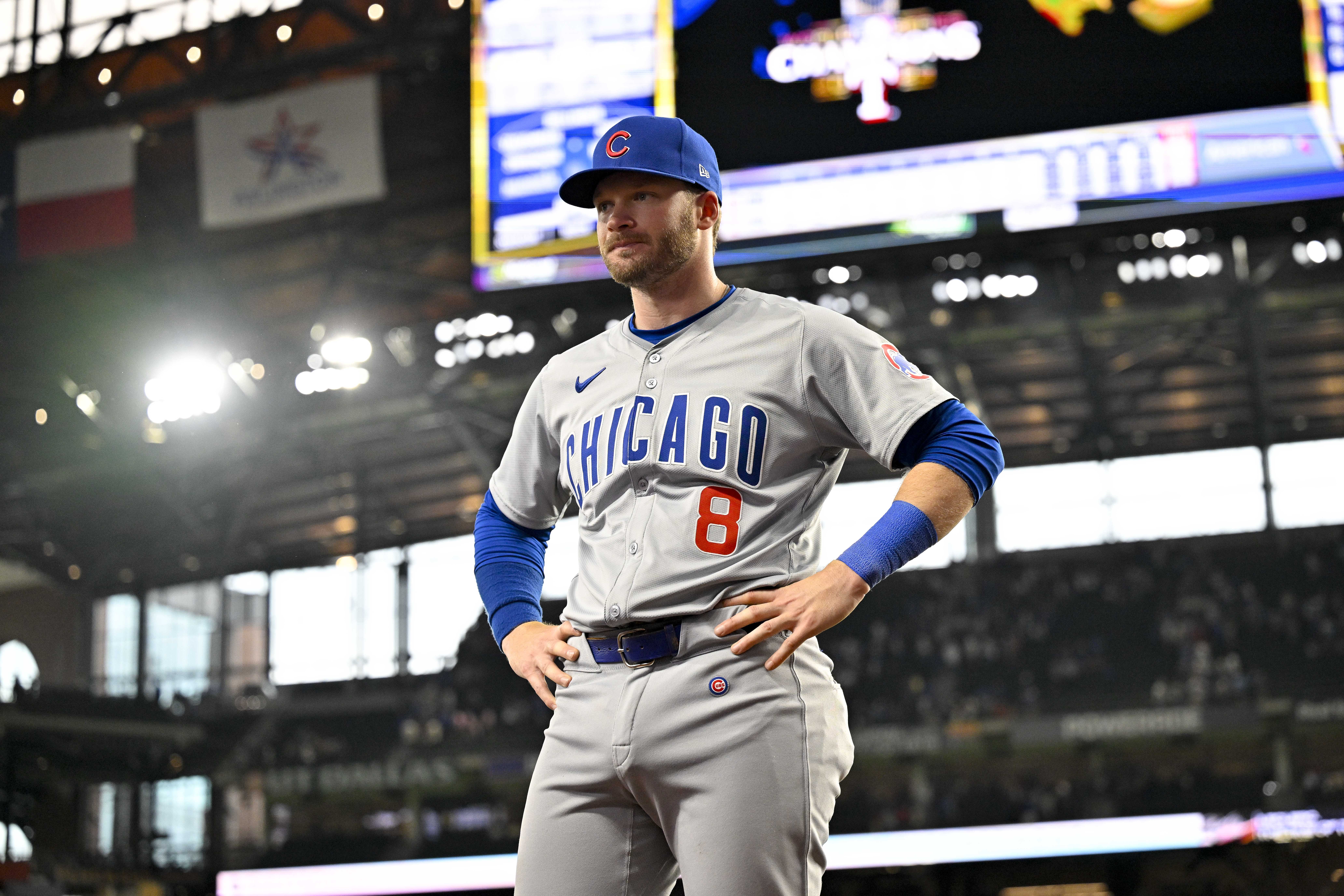 Chicago Cubs designated hitter Ian Happ (8) waits to be interviewed after the Cubs defeat the Texas Rangers at Globe Life Field.